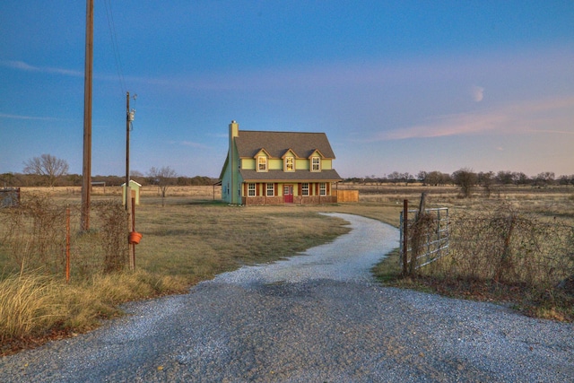 new england style home featuring a rural view