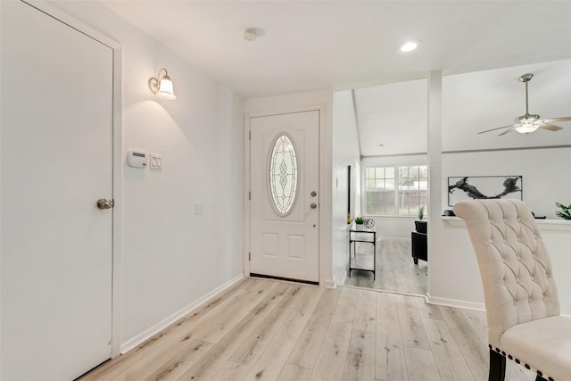 entrance foyer with ceiling fan and light wood-type flooring