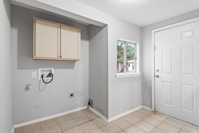 laundry room featuring cabinets, light tile patterned flooring, washer hookup, and hookup for an electric dryer