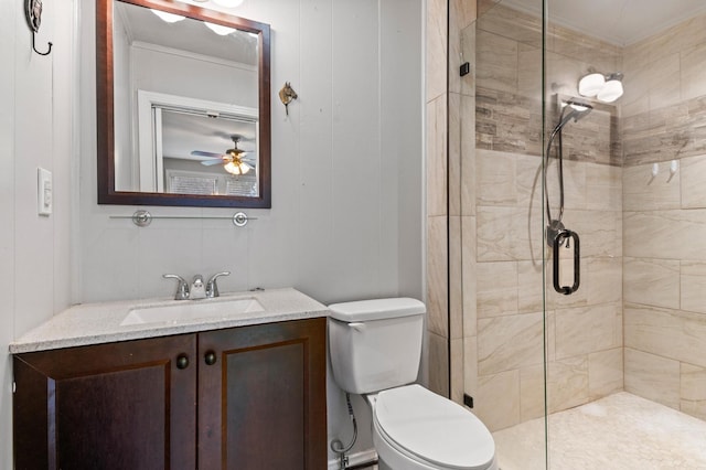 bathroom with vanity, toilet, and a shower with shower door