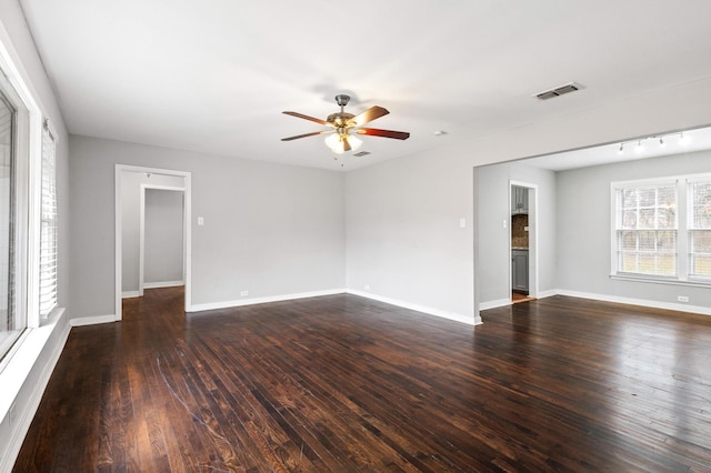 unfurnished room featuring dark hardwood / wood-style floors and ceiling fan