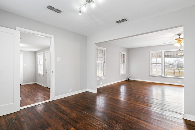 unfurnished room featuring hardwood / wood-style flooring, rail lighting, and ceiling fan