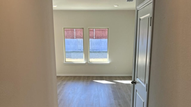 spare room featuring dark hardwood / wood-style flooring