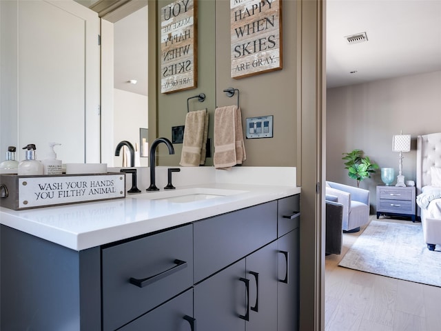 bathroom featuring vanity and hardwood / wood-style flooring