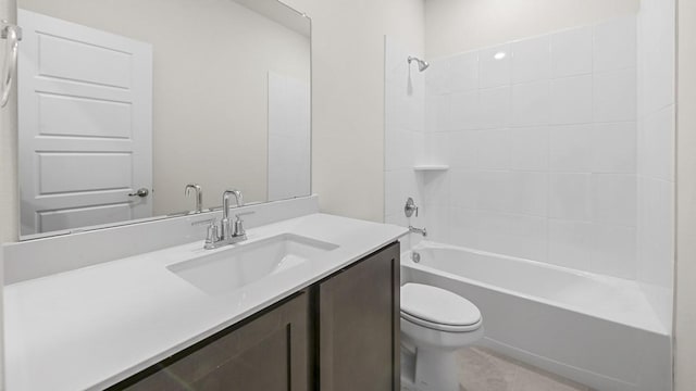 bathroom featuring vanity, bathing tub / shower combination, and toilet