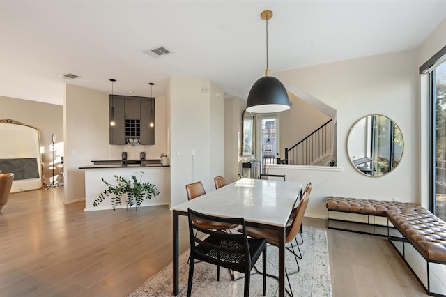 dining space with light wood-type flooring