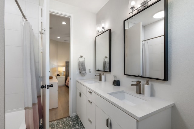 bathroom featuring tile patterned flooring and vanity