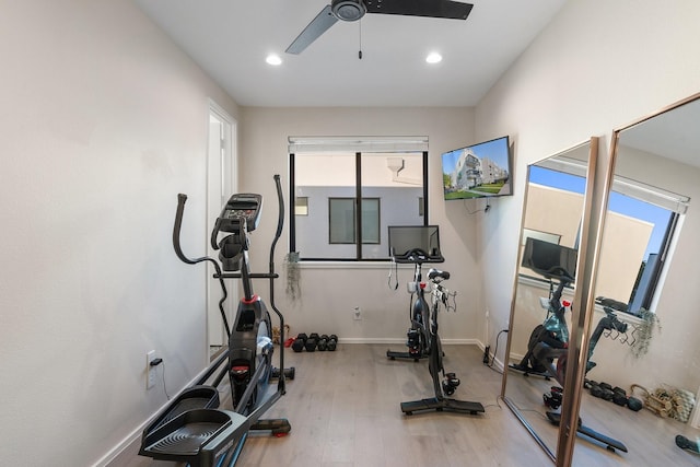 workout room with hardwood / wood-style floors and ceiling fan