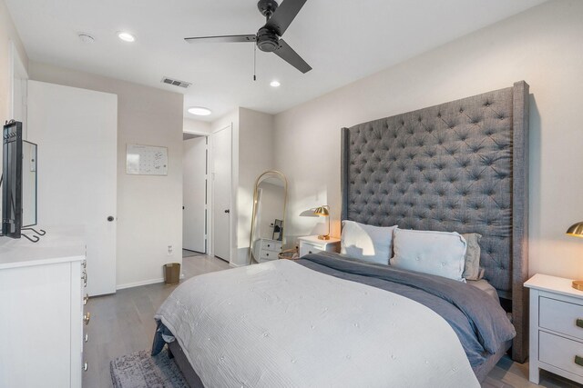 bedroom with light wood-type flooring and ceiling fan