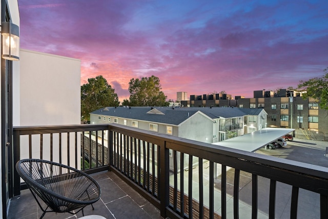 view of balcony at dusk