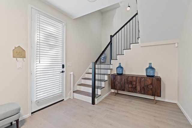 entrance foyer featuring light hardwood / wood-style floors and plenty of natural light