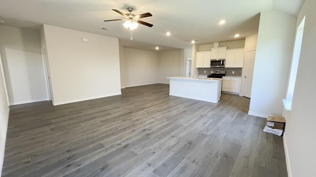 4208 Lucy Ln, Sherman, TX 75090 - kitchen with appliances with stainless steel finishes, open floor plan, backsplash, a ceiling fan, and white cabinets