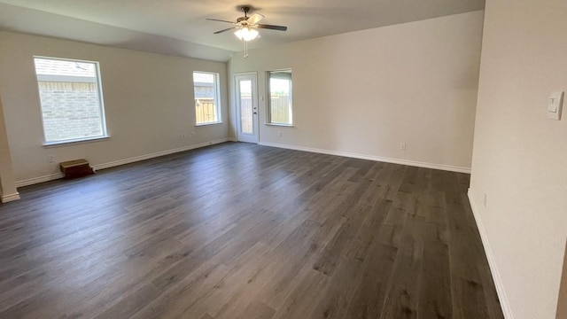 4208 Lucy Ln, Sherman, TX 75090 - empty room with dark wood-style flooring, a ceiling fan, and baseboards