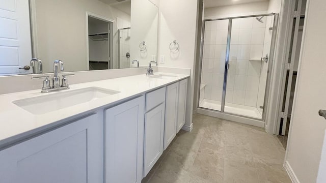 4208 Lucy Ln, Sherman, TX 75090 - bathroom featuring a shower stall, double vanity, and a spacious closet