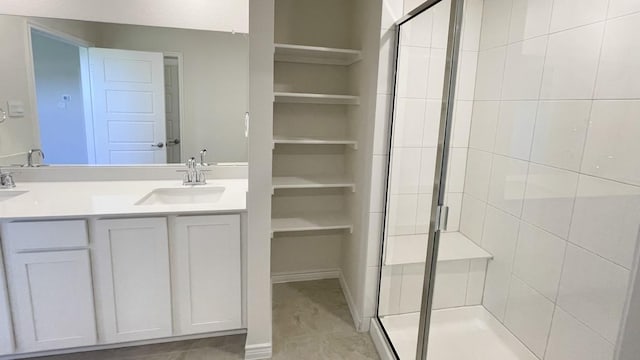 4208 Lucy Ln, Sherman, TX 75090 - bathroom with a stall shower, double vanity, and a spacious closet