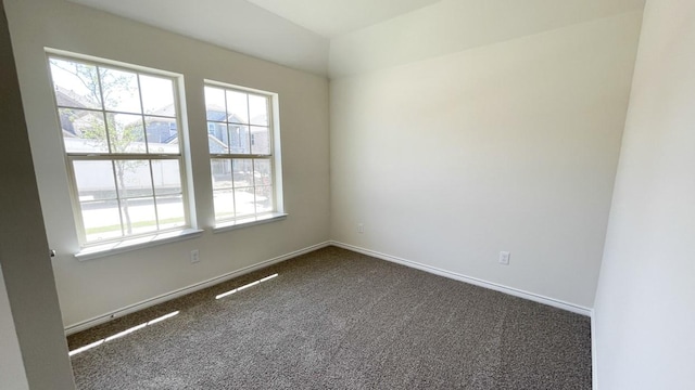 4208 Lucy Ln, Sherman, TX 75090 - unfurnished room featuring dark colored carpet, baseboards, and lofted ceiling