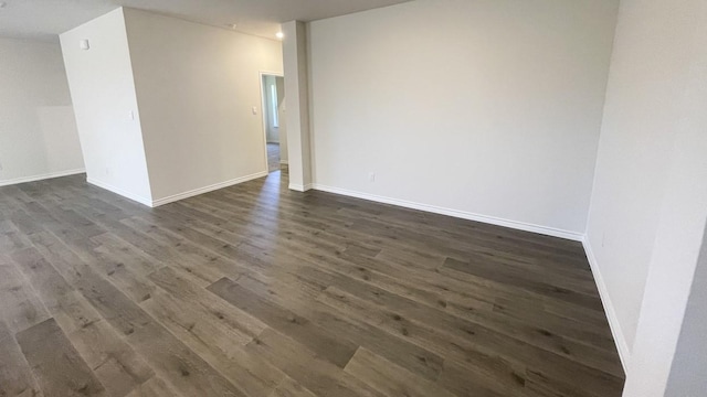 4208 Lucy Ln, Sherman, TX 75090 - empty room featuring dark wood-style floors and baseboards