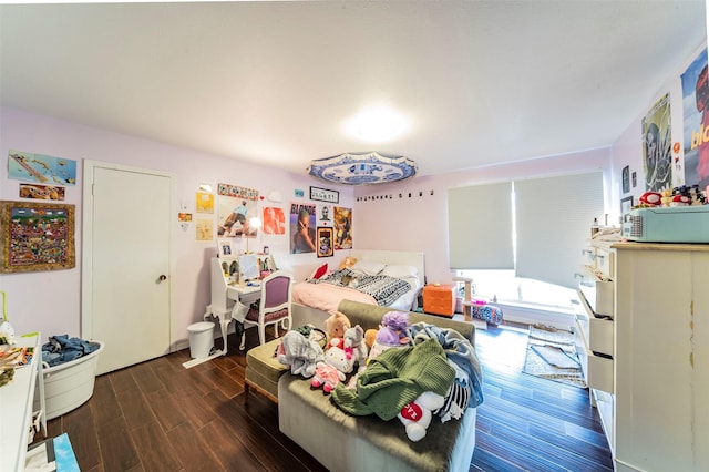 bedroom with dark hardwood / wood-style flooring