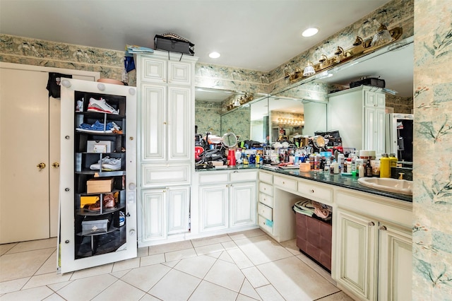 bathroom with tile patterned flooring and vanity