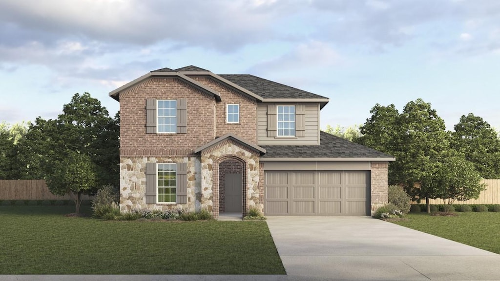 view of front of house with a front yard and a garage