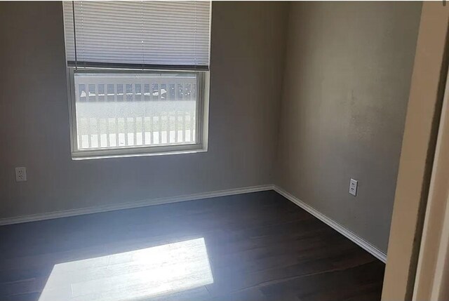 empty room featuring dark hardwood / wood-style floors