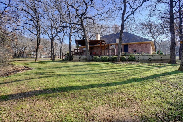 view of yard with a deck