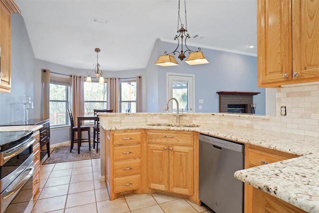 kitchen with sink, dishwasher, stove, decorative backsplash, and pendant lighting