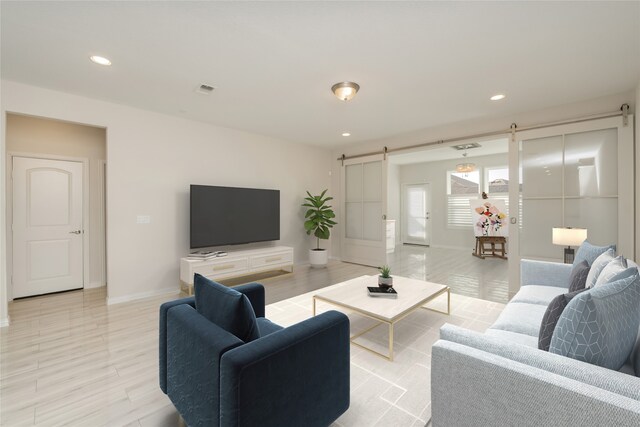 living area featuring an inviting chandelier and light hardwood / wood-style flooring