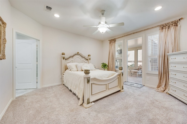 bedroom with ceiling fan and light colored carpet