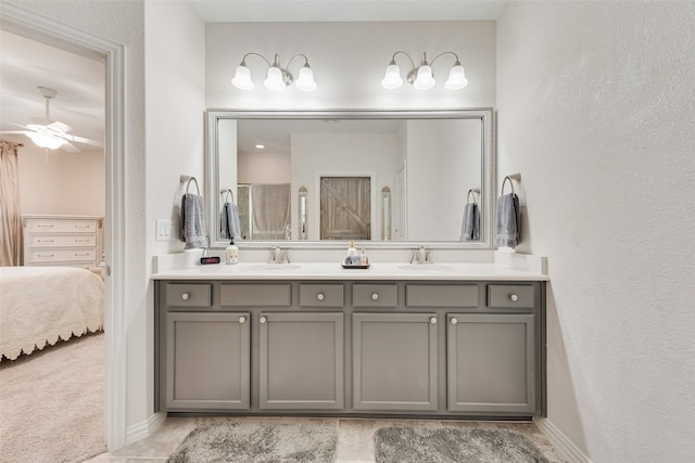 bathroom with vanity, ceiling fan, and a shower with shower door