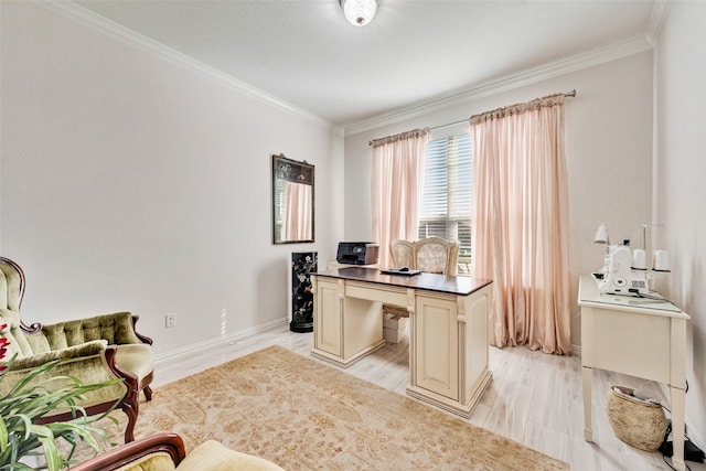 home office with ornamental molding and light hardwood / wood-style flooring