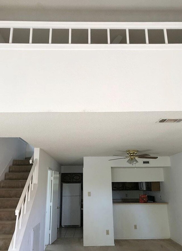 interior space featuring ceiling fan