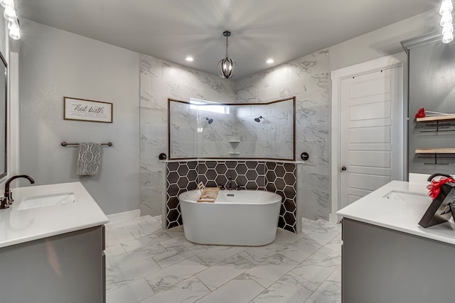 bathroom featuring shower with separate bathtub and vanity