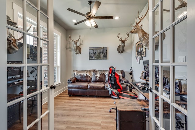 interior space with french doors, hardwood / wood-style flooring, and ceiling fan