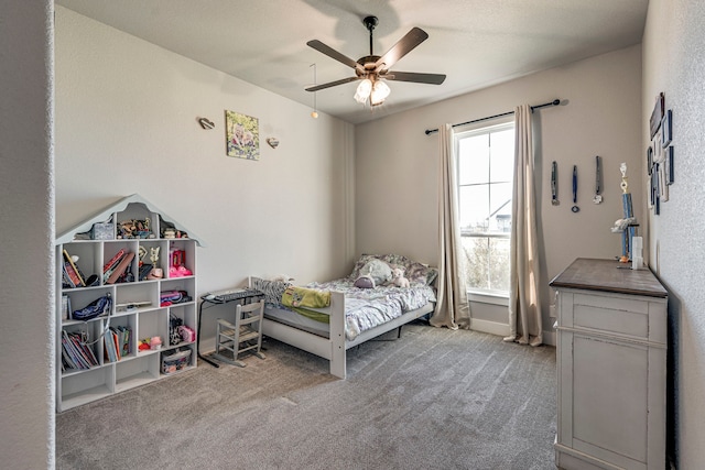 bedroom with multiple windows, carpet, and ceiling fan