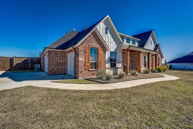 view of front of house featuring a front yard and a garage