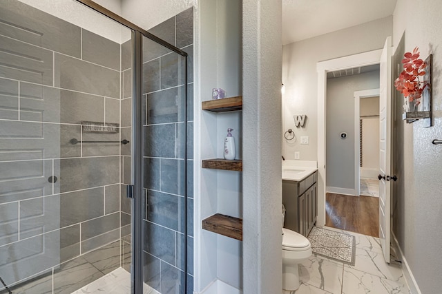 bathroom with vanity, toilet, and walk in shower