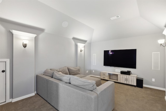 carpeted home theater with vaulted ceiling