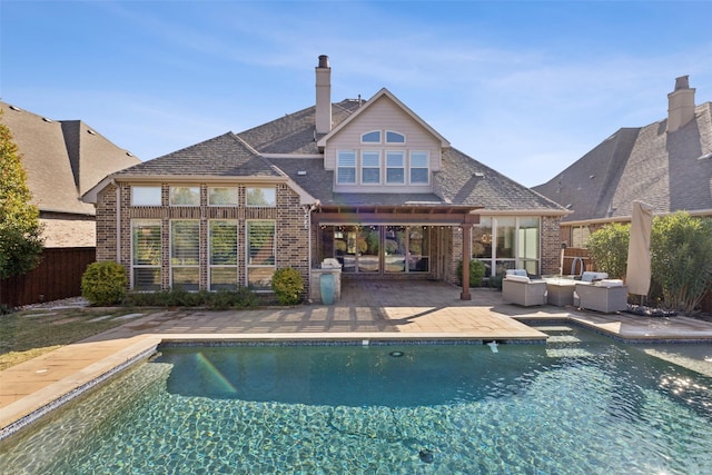 view of swimming pool featuring an outdoor living space and a patio area