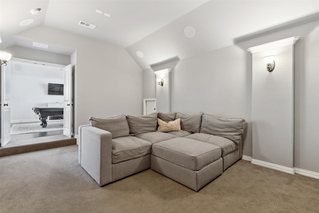 cinema featuring lofted ceiling and light colored carpet