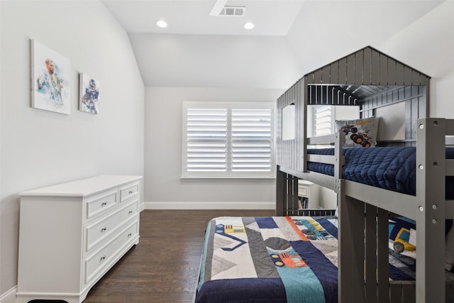 bedroom with dark hardwood / wood-style flooring and vaulted ceiling