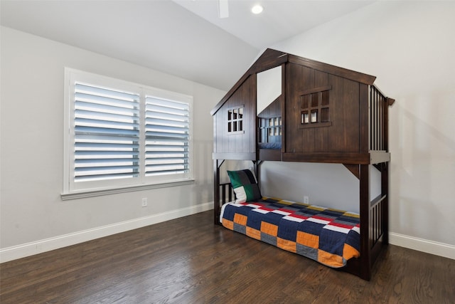 bedroom featuring dark hardwood / wood-style floors and lofted ceiling