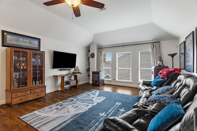 living room with ceiling fan, dark hardwood / wood-style flooring, and vaulted ceiling