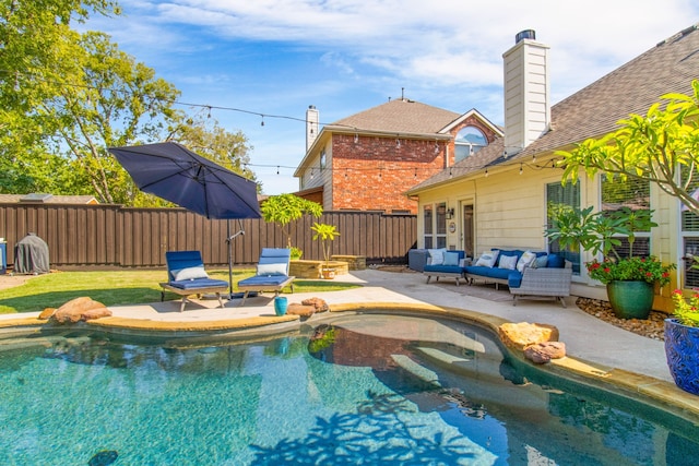 view of swimming pool with a patio area and an outdoor hangout area