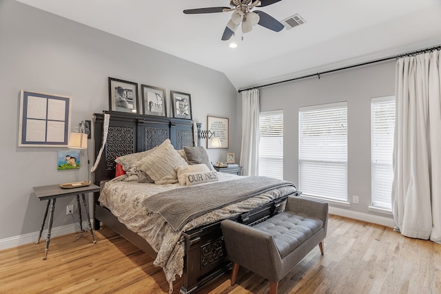 bedroom featuring ceiling fan, vaulted ceiling, and light wood-type flooring