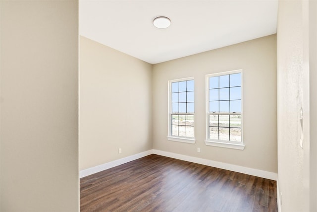 empty room featuring dark hardwood / wood-style flooring