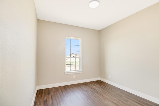 unfurnished room featuring dark hardwood / wood-style flooring