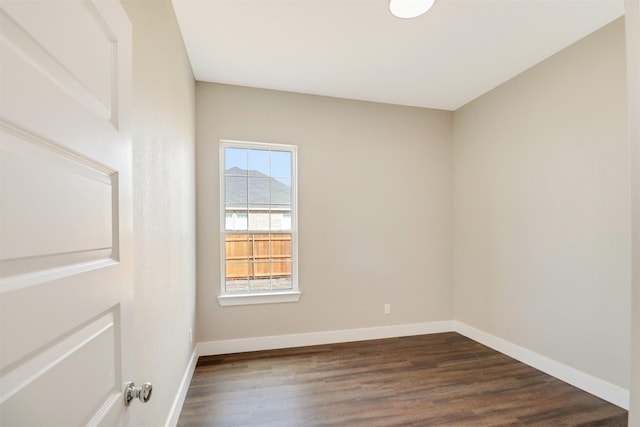 unfurnished room with dark hardwood / wood-style floors