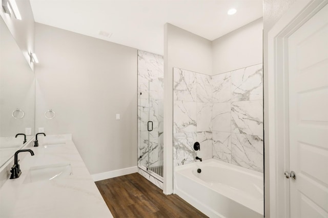 bathroom featuring separate shower and tub, wood-type flooring, and sink