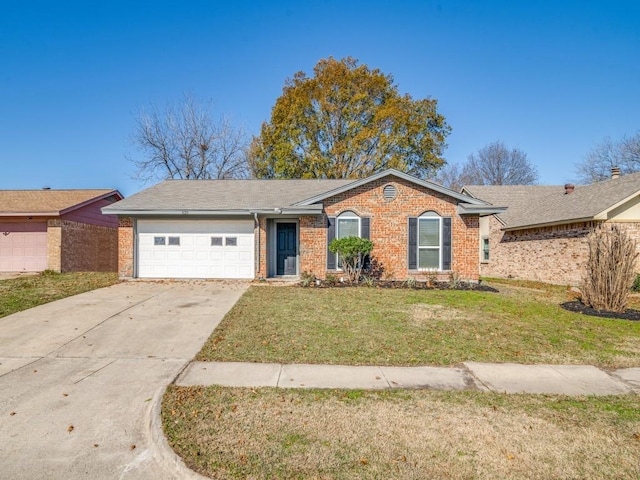 ranch-style house featuring a garage and a front yard